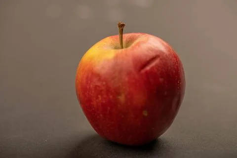 A fresh red apple on a black background. Stock Photos