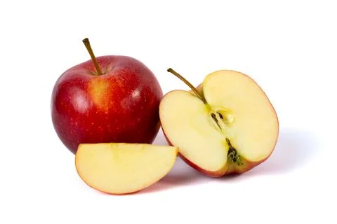 Fresh red apple cut in half isolated on white background. Minimal healthy food Stock Photos