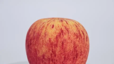 Fresh red apple(rotating) isolated on white background. Stock Footage 243630152