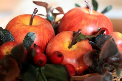 Fresh red apples in a basket on the table as a decoration Stock Photos
