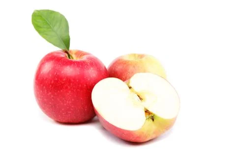 Fresh red apples with a slice isolated on white background. Stock Photos
