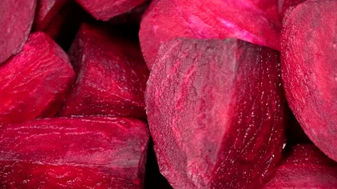 Fresh red beetroot slice rotation background Stock Footage 169512598