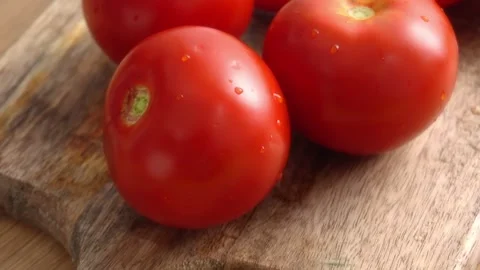 Fresh Red Bell Pepper and Tomatoes on Wooden Cutting Board. Stock Footage 256185807