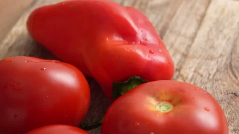 Fresh Red Bell Pepper and Tomatoes on Wooden Surface. Stock Footage 256185857