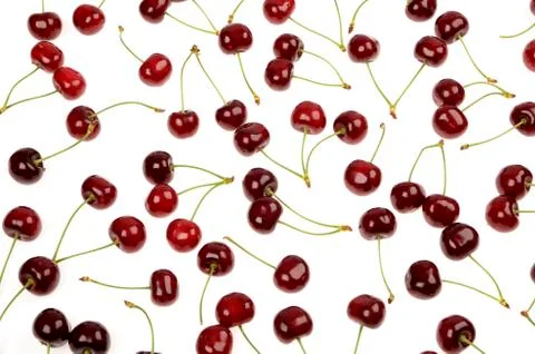 Fresh red cherries background texture on an isolated white background Stock Photos