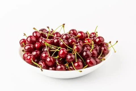 Fresh red cherry fruit in plate  isolated on white background Stock Photos