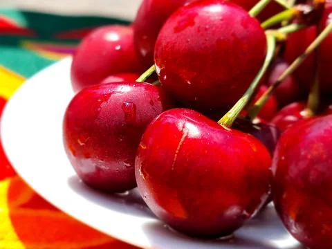 Fresh Red Cherry On A Plate Stock Photos