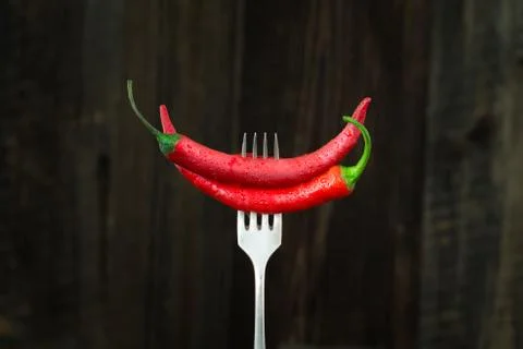 Fresh red chilli pepper on a fork Stock Photos