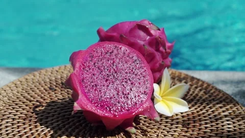 Fresh red dragon fruit cut into two halves Stock Footage 154482805