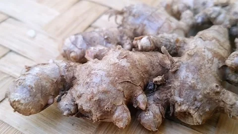 Fresh Red Ginger Roots on Bamboo Mat Stock Footage 340618978