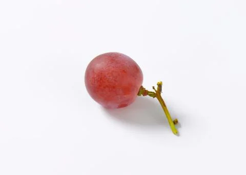 Fresh red grape with green stem on white Stock Photos