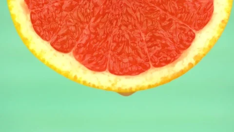 Fresh Red Grapefruit Slice On Table Stock Footage 85174776