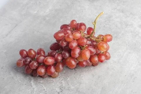 Fresh red grapes on a gray background Stock Photos