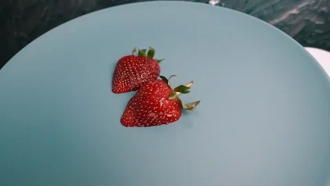 Fresh red half strawberries rotating Stock-Footage 107732846