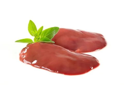 Fresh red meat with mint leaf garnish Stock Photos