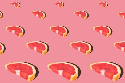 Fresh red orange or grapefruit on a peach color background. Stock Photos