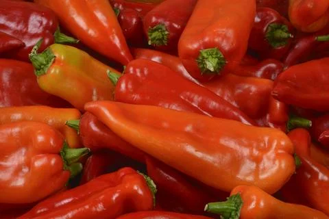 Fresh red pointed peppers texture background Stock Photos