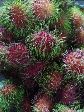 Fresh red rambutans fruit background Foto stock
