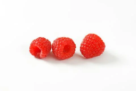 Fresh red raspberries on clean background Stock Photos