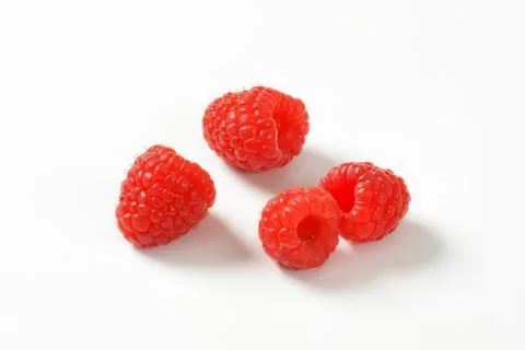 Fresh red raspberries on clean surface Stock Photos
