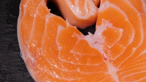 Fresh red salmon texture. Closeup, close up macro fish steak with lemon and Stock-Footage 119928212