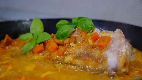 Fresh Red Snapper hot in the frying pan with carrot, garlic, basil,  savour.. Stock Footage 334829834