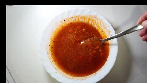 Fresh red soup top view slow motion Stock Footage 300502388