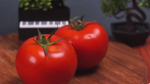 Fresh red tomatoes. Arms. Camera movement. Red and green in the frame Stock Footage 217408117