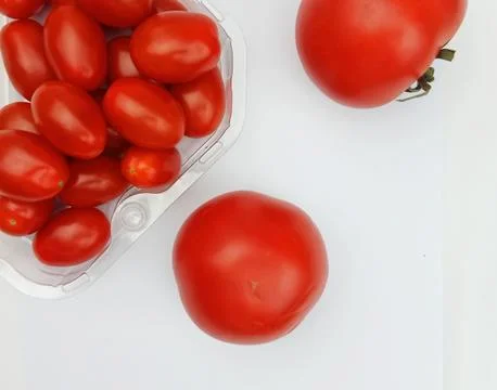 Fresh red tomatoes flat lay on white background Stock Photos