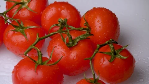 Fresh red tomatoes rotating on white background close-up. Stock Footage 115828856