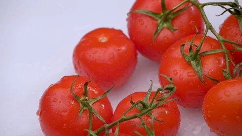 Fresh red tomatoes rotating on white background close-up. Stock Footage 115829052