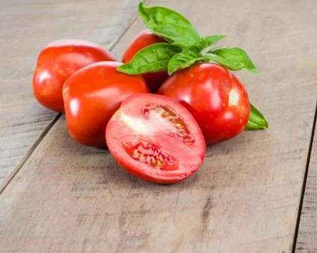 Fresh red tomatoes on a table Stock Photos