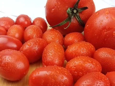 Fresh red tomatoes with water drops close up food background Stock Photos