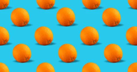 Fresh repeating orange fruit on blue background Stock-Fotos