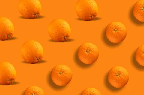 Fresh repeating orange fruit on orange background Stock-Fotos