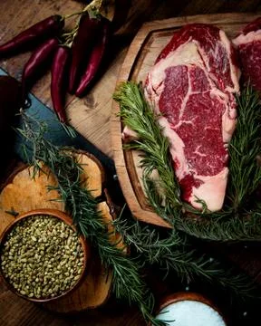 Fresh rib eye steak on the table Stock Photos