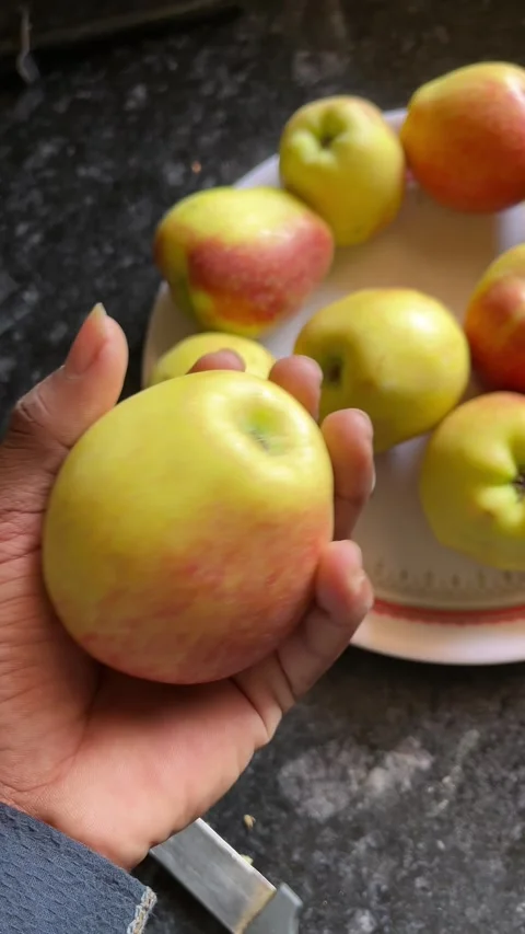 Fresh Ripe Apple Held in Hand and Shown to the Camera Видео 321127440