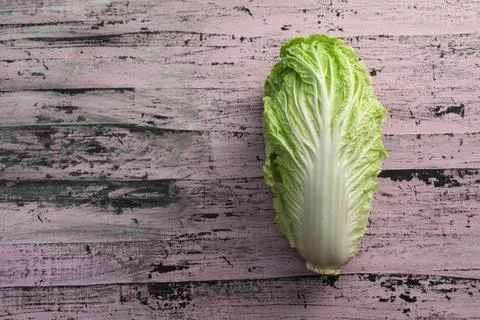 Fresh ripe Chinese cabbage on rustic table, top view. Space for text Stock Photos