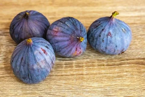 Fresh ripe figs on light background Stock Photos