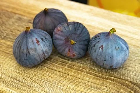 Fresh ripe figs on light background Stock Photos