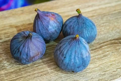 Fresh ripe figs on light background Stock Photos