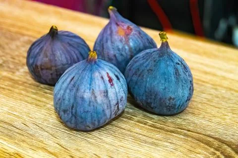 Fresh ripe figs on light background Stock Photos