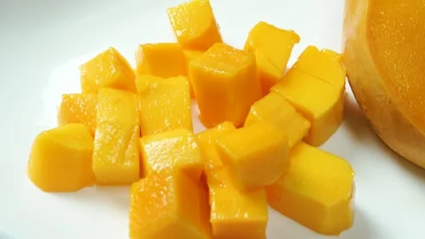 Fresh Ripe Mango Cube Cut on Plate Stock Footage 310974765