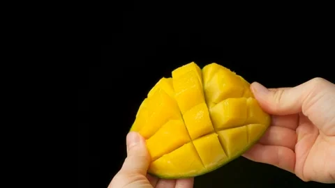 Fresh Ripe Mango Half Cut into Cubes in Human Hands Stock Footage 327389309