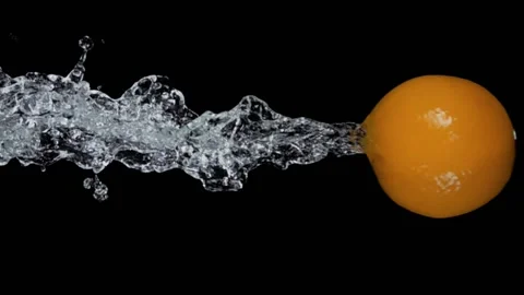 Fresh ripe orange is bouncing from the water with drops and splashes Stock Footage 171412748