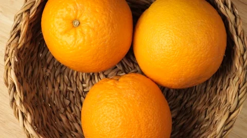 Fresh ripe oranges rotating in a basket Stock Footage 341822982