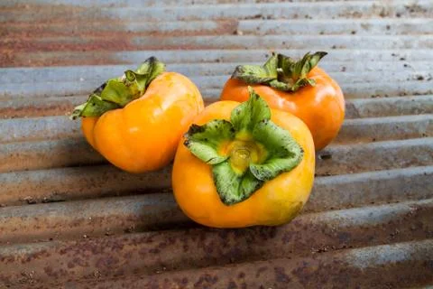 Fresh ripe persimmon Stock Photos
