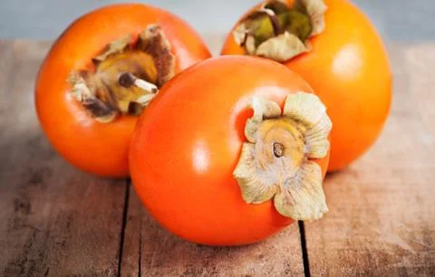 Fresh ripe persimmon Stock Photos