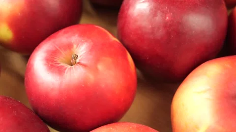 Fresh ripe red apples rotating in a crate Stock Footage 335559885