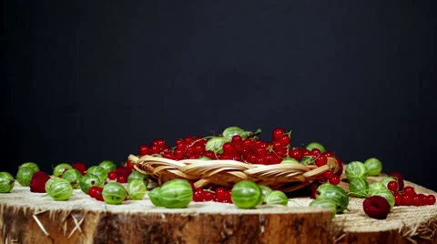 Fresh ripe red currant in the wicker bowl decorated fresh berries Stock Footage 64929700
